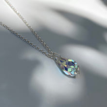 Load image into Gallery viewer, Silver necklace with multifaceted aurora borealis crystal pendant. Chain is made from polished 925 (sterling) silver, pendant made from crystal glass. The length of the chain is 50 cm, the pendant is 18mm long.