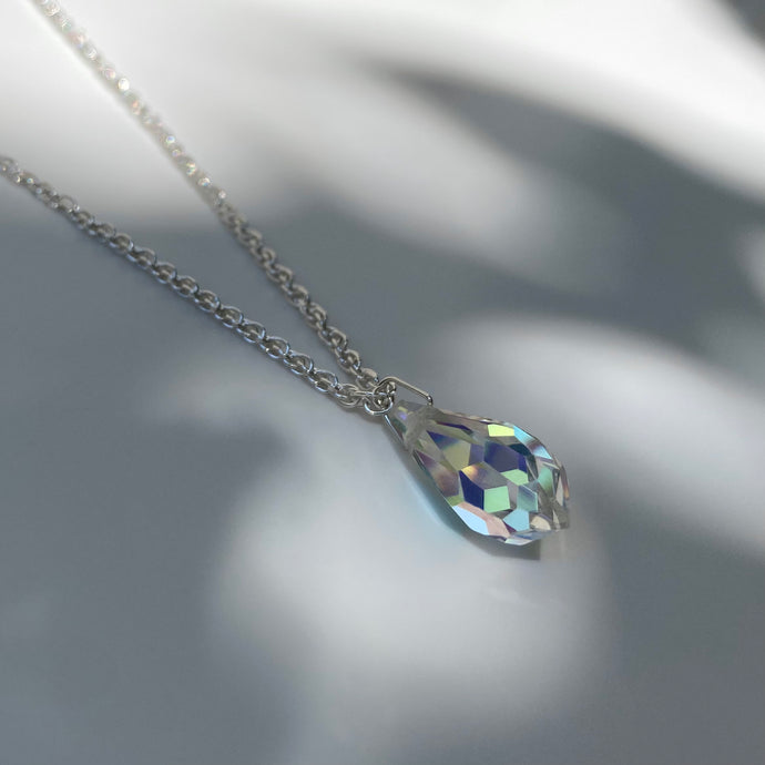 Silver necklace with multifaceted aurora borealis crystal pendant. Chain is made from polished 925 (sterling) silver, pendant made from crystal glass. The length of the chain is 50 cm, the pendant is 18mm long.